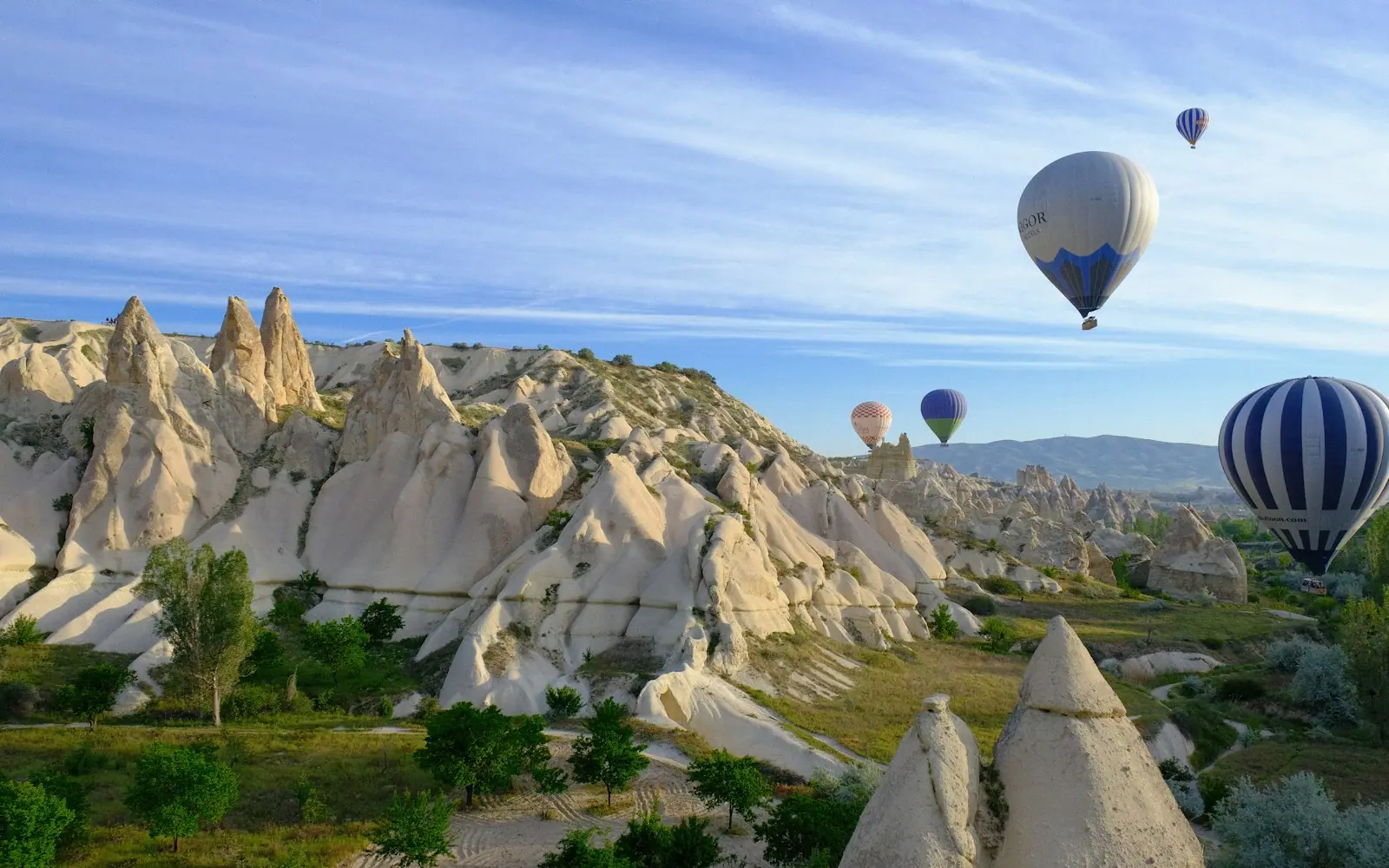 Hot-air balloons over the fairy chimneys of Cappadocia at sunrise