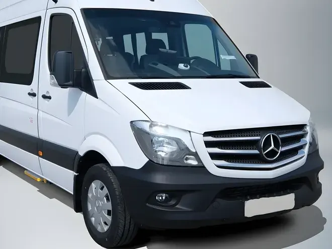 White Mercedes Sprinter minibus, front three-quarter view