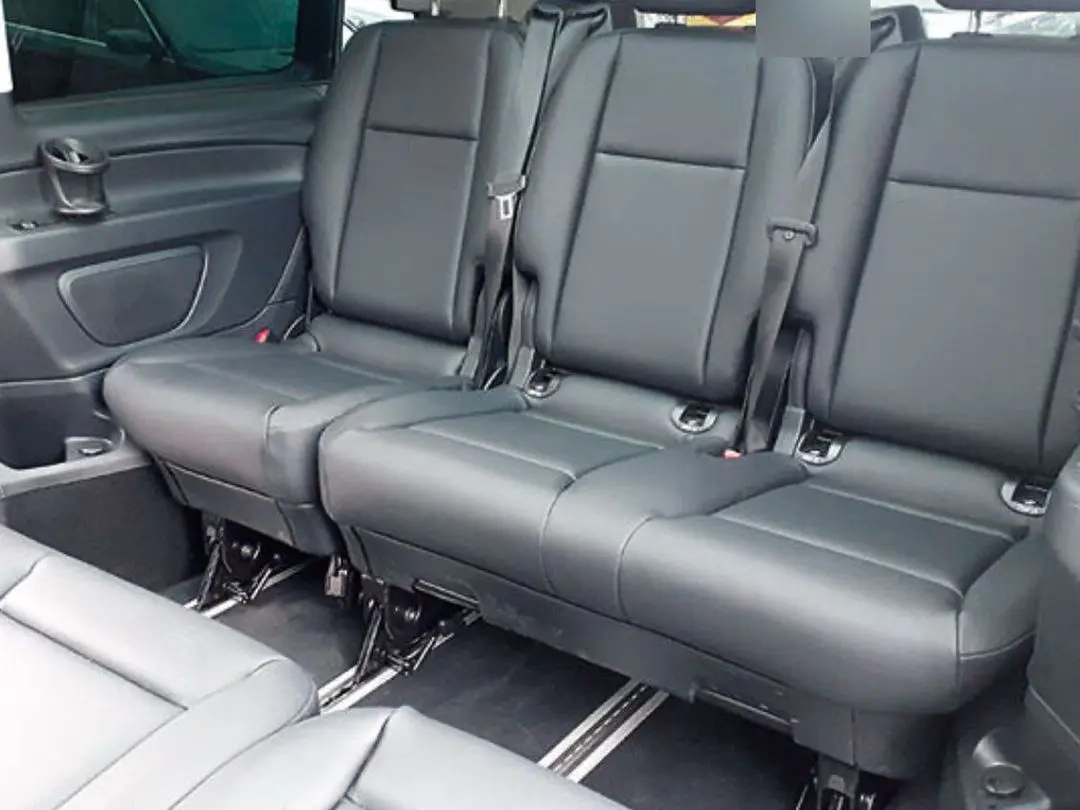 Standard VIP minivan cabin with black leather bench seats