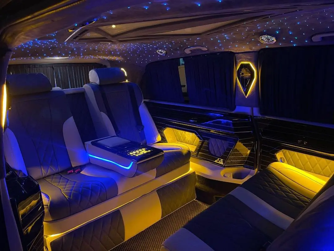 Ultra luxury VIP cabin in warm ambient light with quilted door panels
