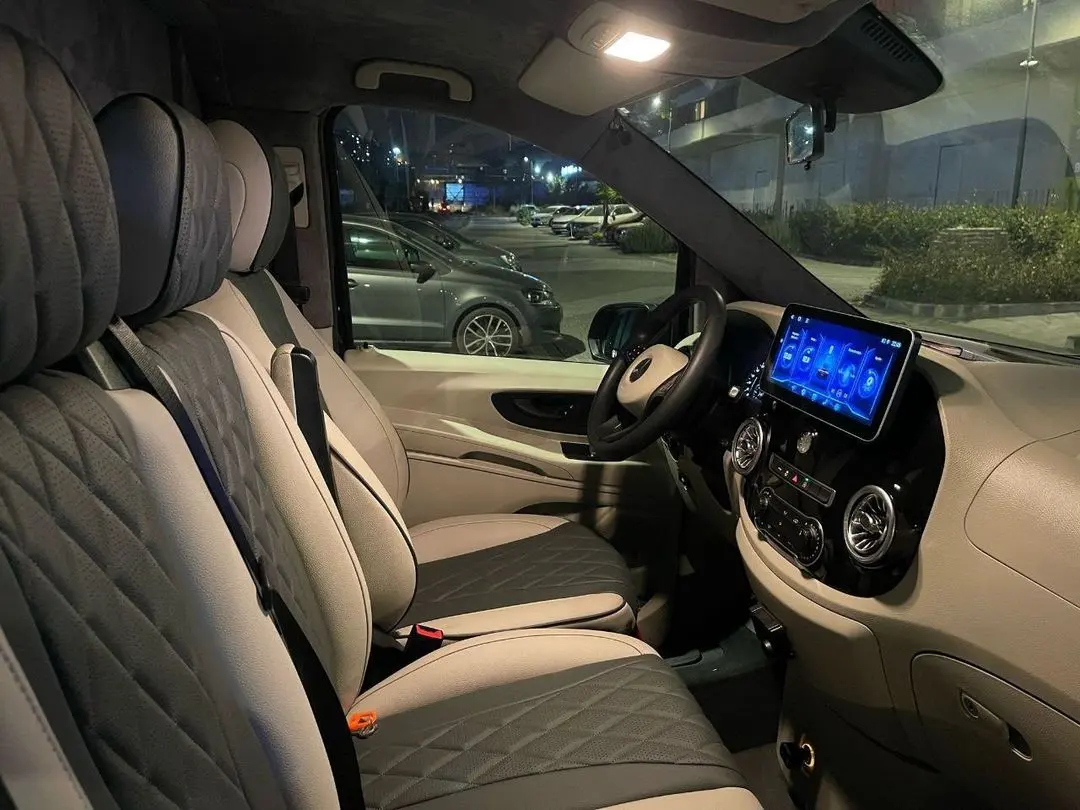 Ultra luxury VIP van front cabin with quilted leather seats and touchscreen