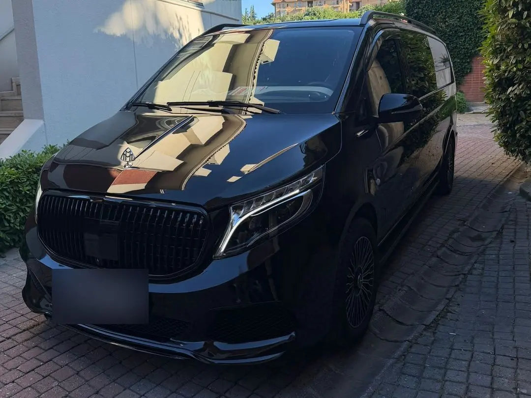 Black Mercedes van with a Maybach-style grille