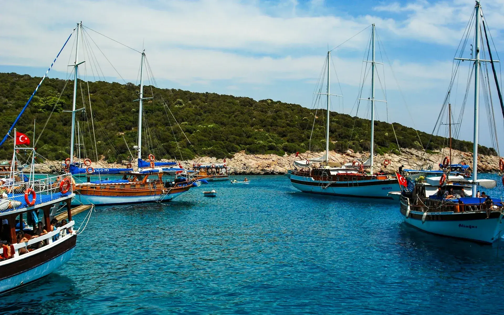 Wooden gulets moored in a turquoise Bodrum bay