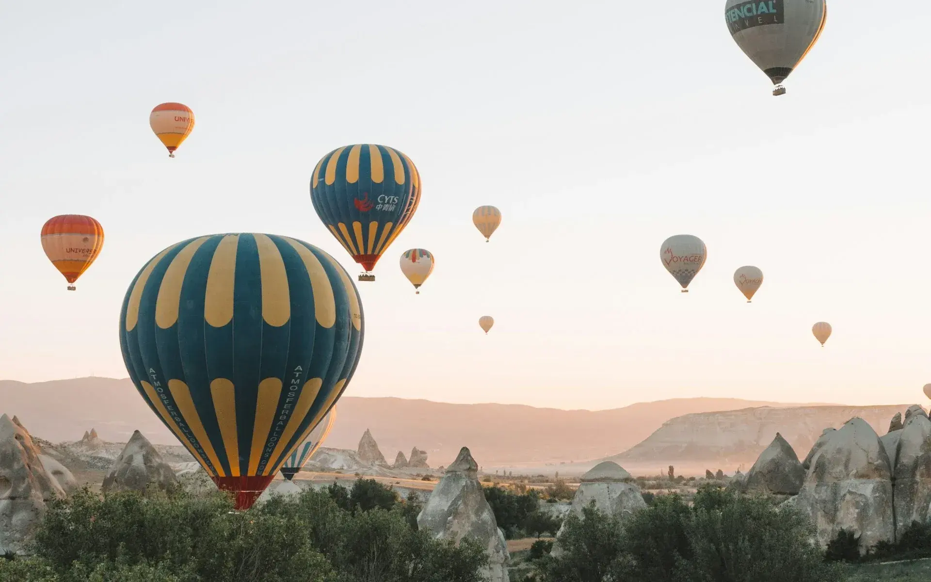 Hot air balloons rising close over the Cappadocian valleys