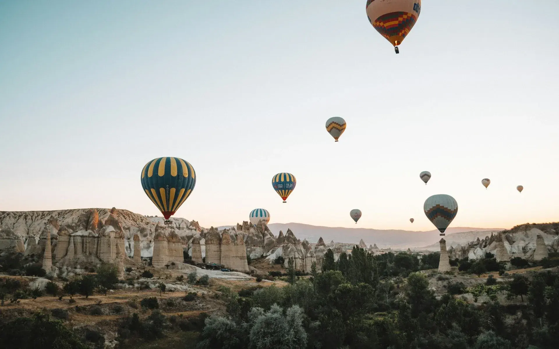 Balloons drifting low over the fairy chimneys