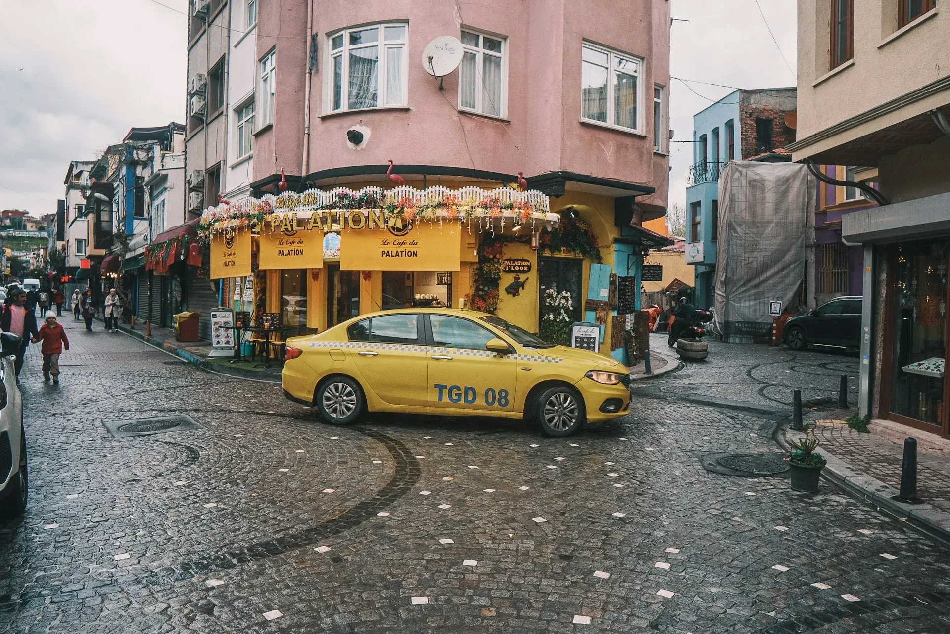 A yellow Istanbul taxi waiting on a city street