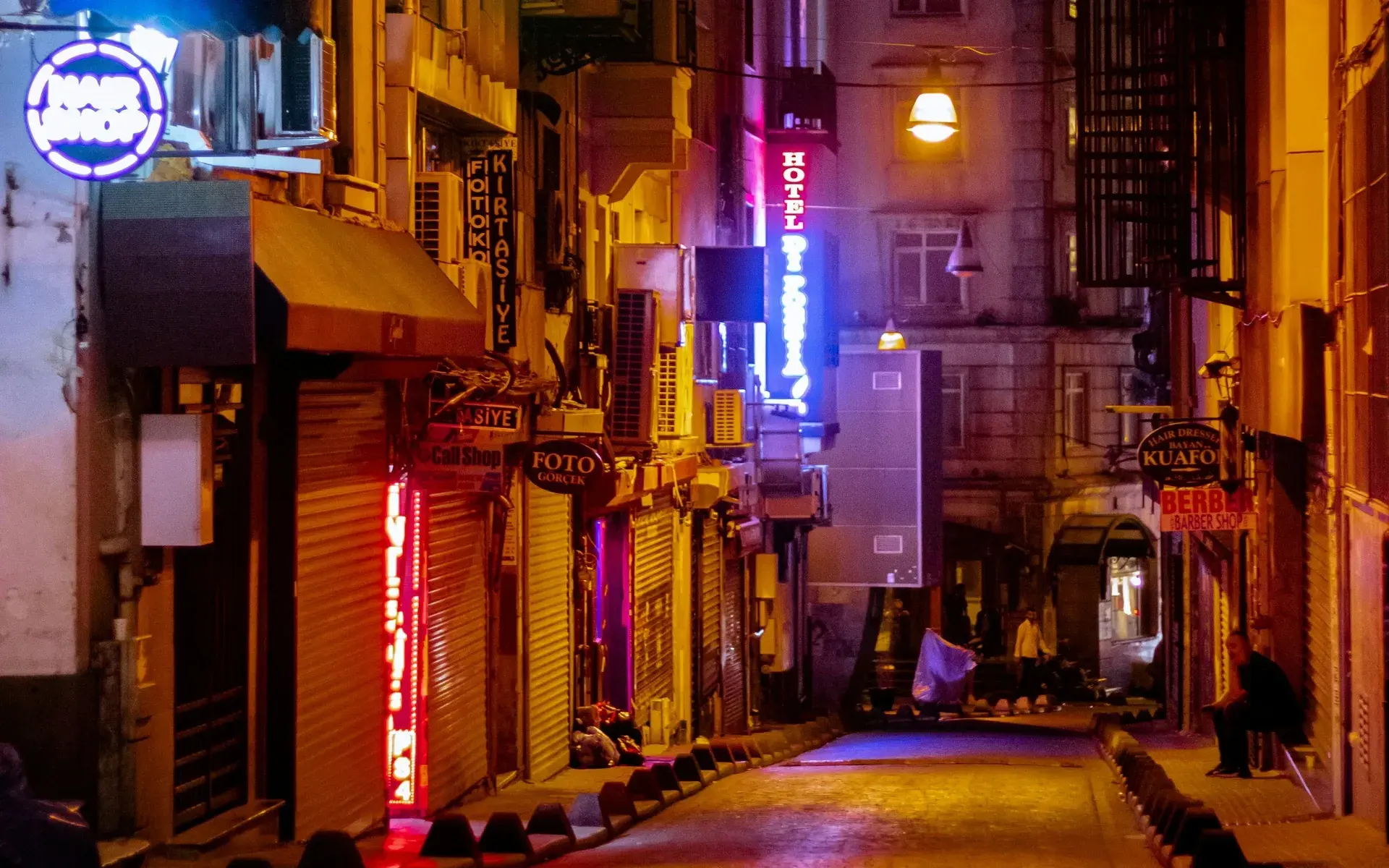 A neon-lit side street near Taksim late at night