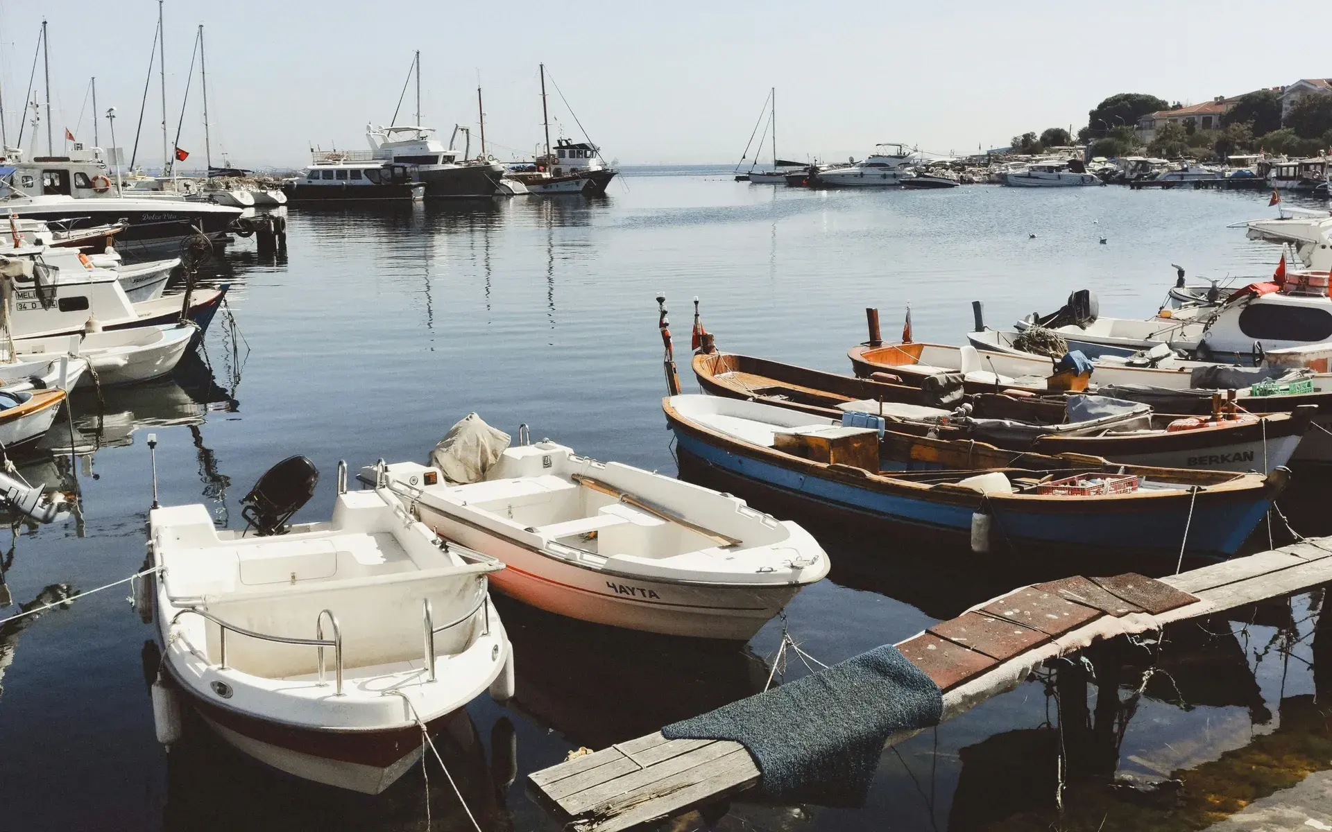 Small boats moored at a pier on Büyükada, the largest of the Princes Islands