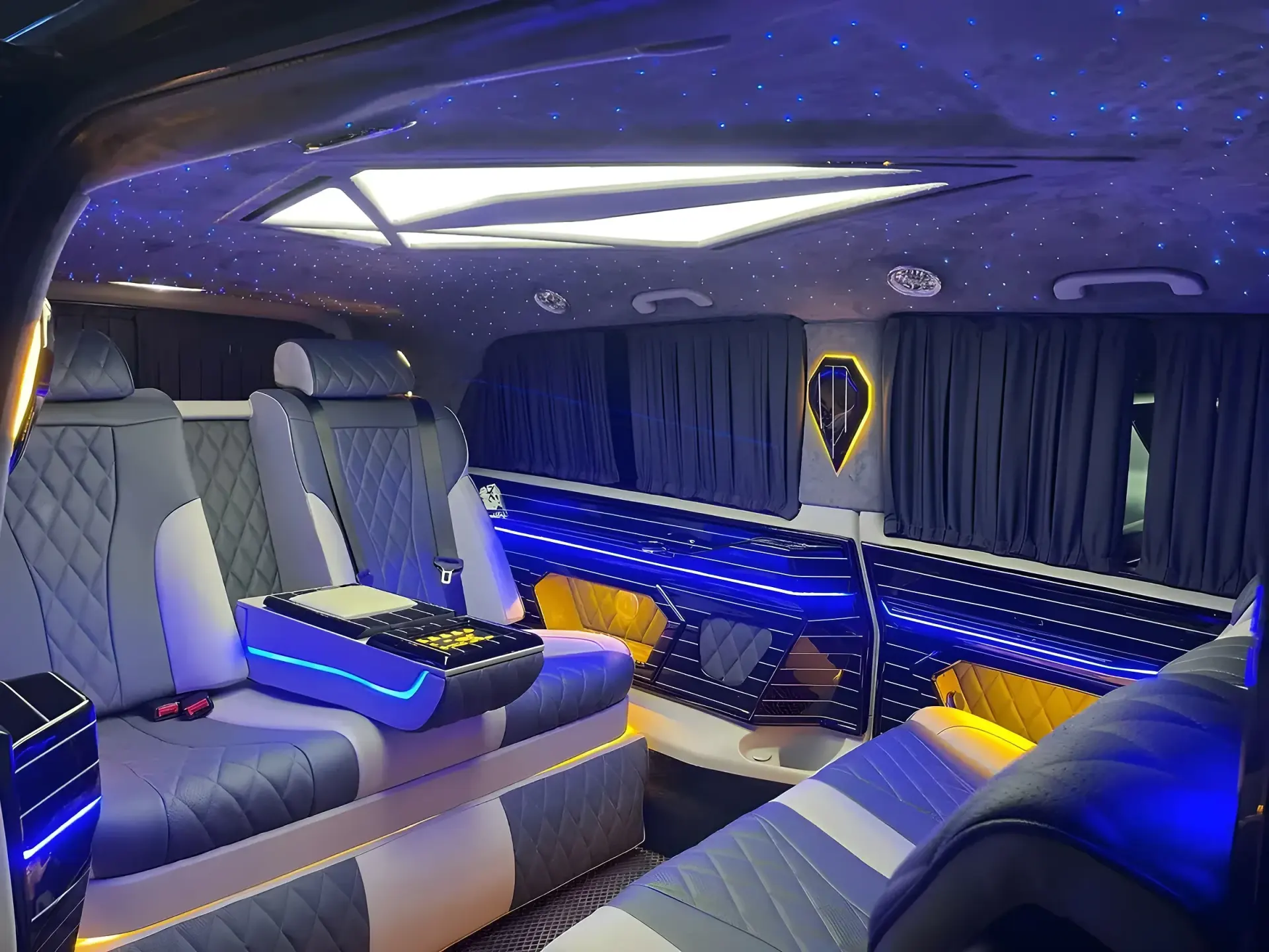 Inside a VIP van: leather lounge seats and ambient lighting