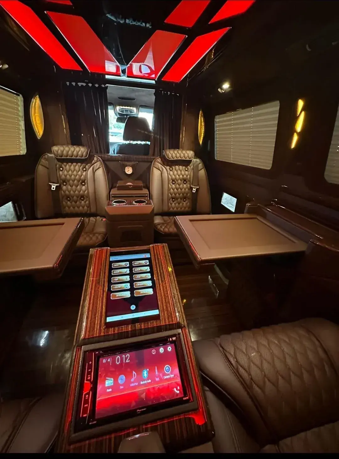 Mercedes V-Class VIP interior with folding tables, entertainment screens and ambient lighting